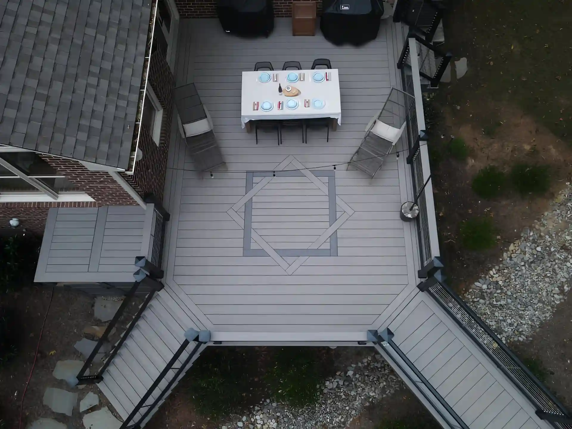 Aerial view of a gray composite deck with black aluminum railing